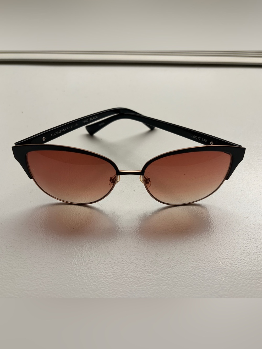 BCBGMaxAzria Black Frame Sunglasses with Rose Gradient Lenses